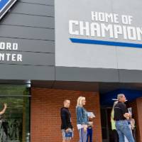 Guests standing outside the new Jamie Hosford Football Center at the Jamie Hosford Football Center dedication.